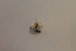 A diamond cluster ring, upon a yellow gold shank,