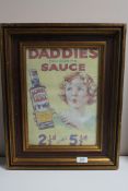 A framed Daddie's Famous Sauce advertisement