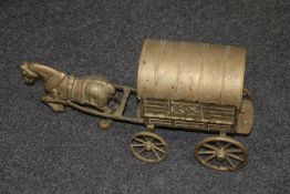 A heavy brass gypsy caravan with horse CONDITION REPORT: Measures 52cm long,