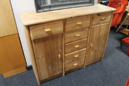 A stripped pine sideboard