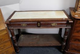 An antique oak two-tier serving table with inset marble panel