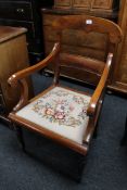 A late nineteenth century tapestry seated armchair