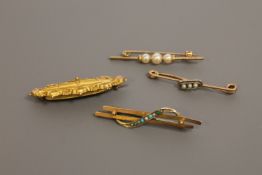 Four various gold brooches, 7.