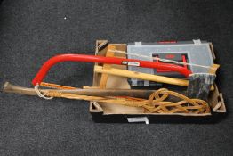 A box of Keter plastic tool box and hand tools, two saws,
