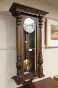A continental wall clock with enamelled dial