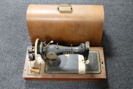 A walnut cased Pfaff hand sewing machine