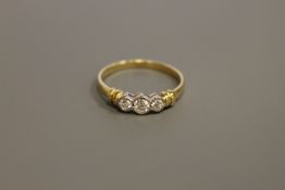 An 18ct gold three stone diamond ring, total diamond weight estimated at 0.