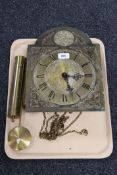 A Tempus Fugit brass clock movement with pendulum and weights
