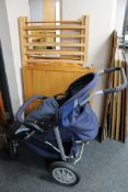 A pine child's cot and an Urban Detour push chair