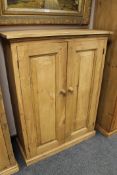 A pine double door low cupboard
