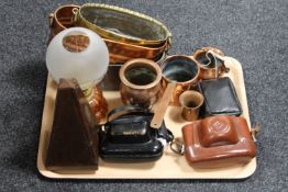 A tray of cameras, metronome, copper and brass planters.