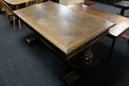 An early 20th century heavily carved oak library table fitted three drawers CONDITION