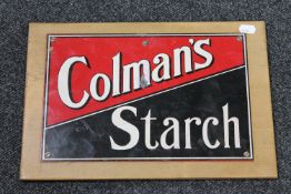 A Colman's Starch advertisement mounted on pine board