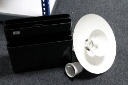 A contemporary Italian Kartell black plastic magazine rack together with a circular metal light