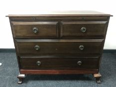 A late Victorian four drawer chest with slide