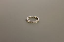 A platinum and diamond eternity ring CONDITION REPORT: The ring is size N/O.