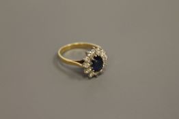 A fine quality 18ct gold sapphire and diamond cluster ring (NB - believed to be a Kashmir sapphire)