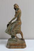 An adzed oak Art Deco figure depicting a lady in flowing dress holding a fan CONDITION