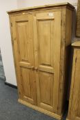 A pine double door cupboard