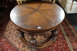 An early 20th century circular carved oak coffee table