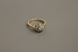 An 18ct gold diamond cluster ring,