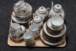 A tray of Japanese egg shell tea service and tea plates CONDITION REPORT: Two of