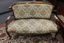 A continental walnut salon settee CONDITION REPORT: This measures 137cm wide by