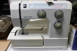 A Riccar Diamond 829 electric sewing machine with pedal in carry bag