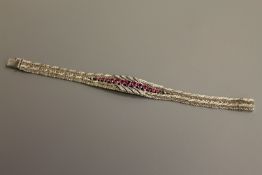 A fine quality ruby and diamond bracelet in 18ct white gold, 52g.