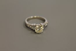 An 18ct gold solitaire diamond ring, the principal stone weighing an estimated 1.