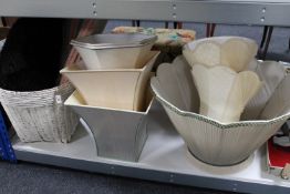 Eight assorted table lamps and shades together with a wicker log basket of rugs