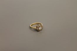 An 18ct gold diamond cluster ring, the central stone estimated at 0.