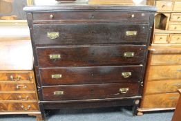 A late nineteenth century oak five drawer chest with brass drop handles