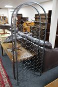 A metal domed topped wine rack