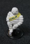 A cast iron sitting Michelin figure