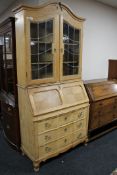 A blond oak leaded glass door bureau bookcase