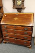 A Victorian inlaid mahogany bureau