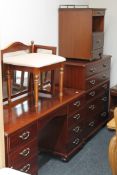 A contemporary Mcdonagh five piece mahogany bedroom suite comprising of five drawer chest,