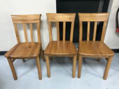 A set of six pine dining chairs