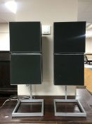 A pair of Bang and Olufsen Beovox S45 speakers on stands