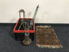 A box of brass faced wall clock, miniature prayer rug,