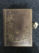A Victorian leather bound musical photograph album