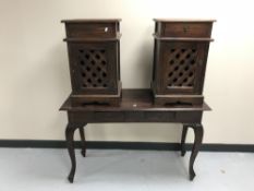 A contemporary hardwood two-drawer console table together with a pair of bedside cabinets with