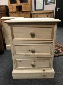 A pine three drawer bedside chest,