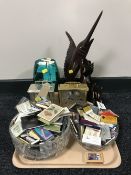 A tray containing wood carvings glass bowls, two battery operated mantel clocks,