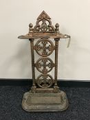 An early 20th century cast iron stick stand with lift out tray