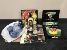 A tray containing three Mary Nailor china wall plaques, together with a china plaque of a bartender,