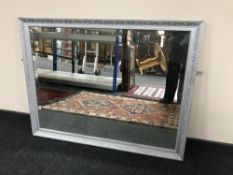 A silvered framed mirror