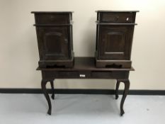 A contemporary hardwood two-drawer console table together with a pair of bedside cabinets with