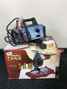 A boxed Power Devil mitre saw and a Ring car battery charger